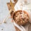 a bowl of cereal with milk pouring into it