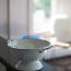 a white colander on a counter