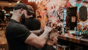 a person cutting a person's hair