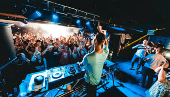 a person standing in front of a large crowd of people