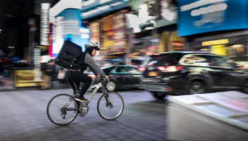 a person riding a bike with a backpack