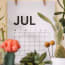 a calendar with a date and flowers