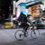 a person riding a bike with a backpack