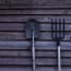 a shovel and pitchfork on a wall