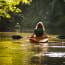 a person in a kayak on a river