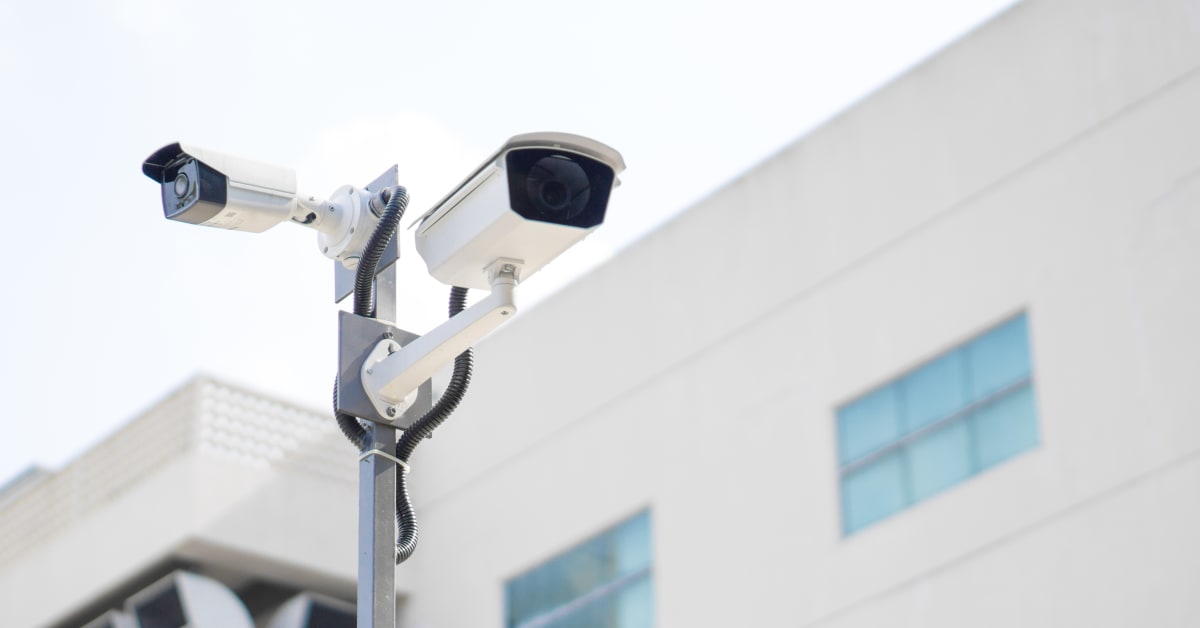 Image of security cameras in front of building Image of security cameras in front of building