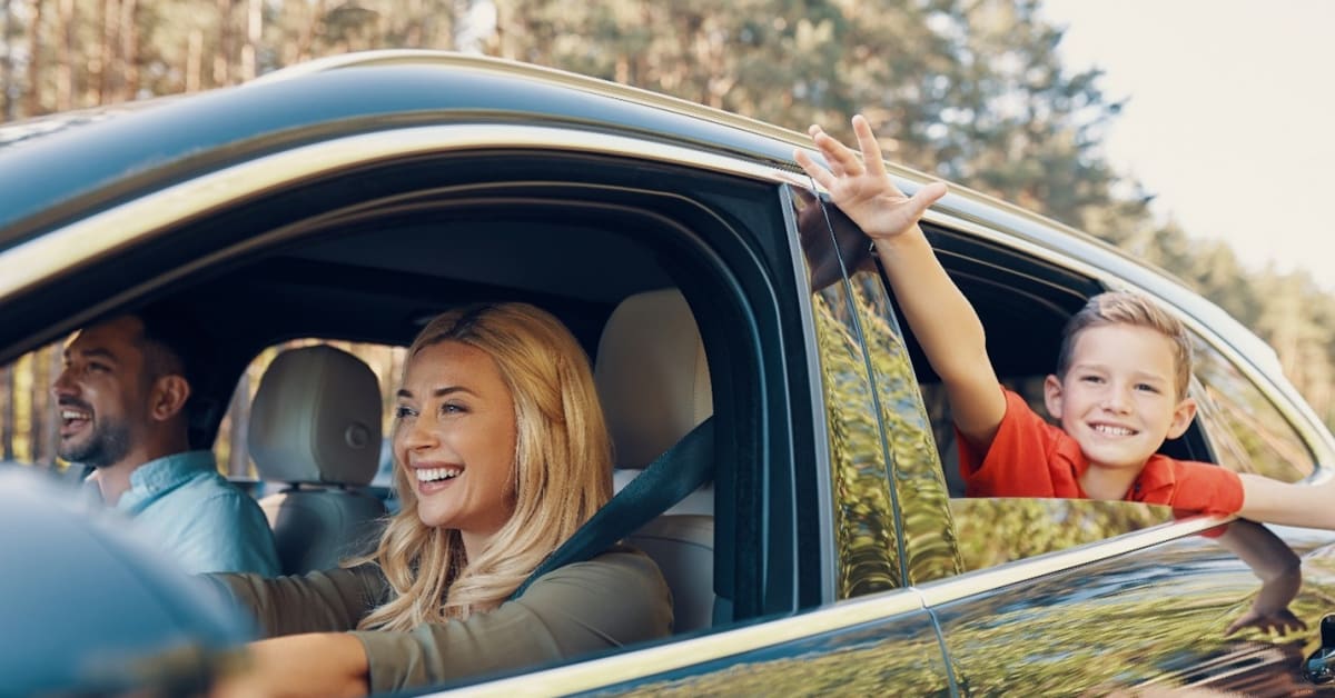 Picture of woman driving and boy is looking outside of the car window Picture of woman driving and boy is looking outside of the car window