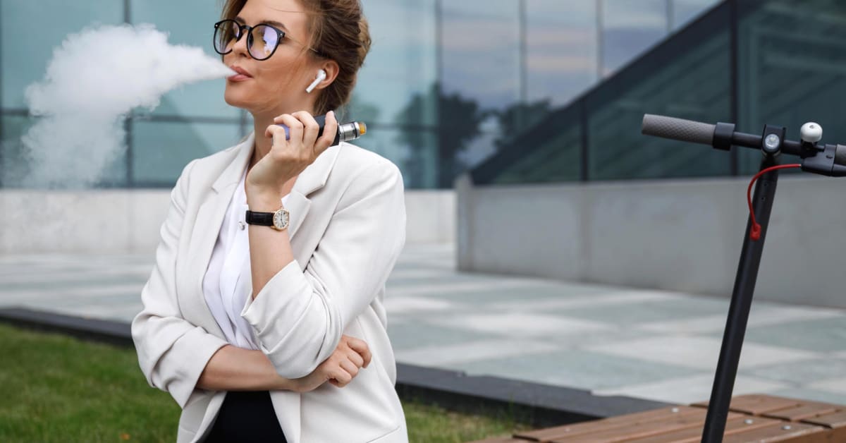 image of a female employee smoking outside of work