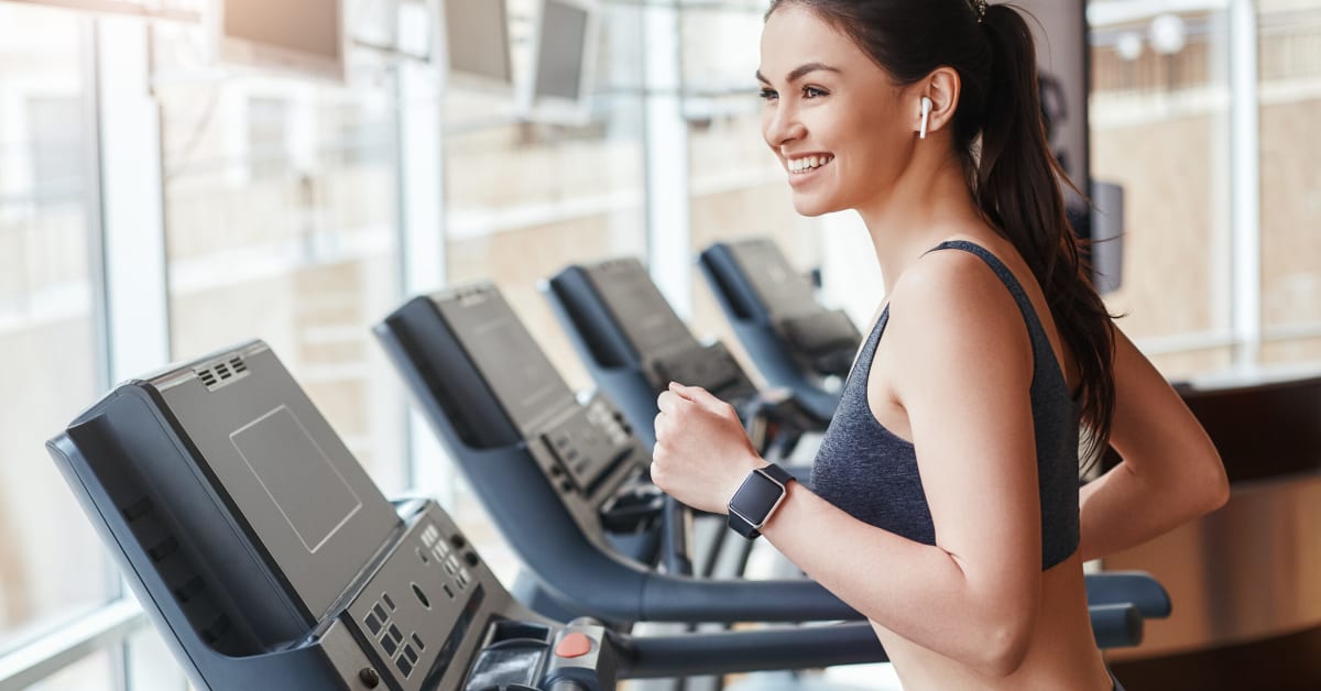image of a young woman on a treadmill image of a young woman on a treadmill