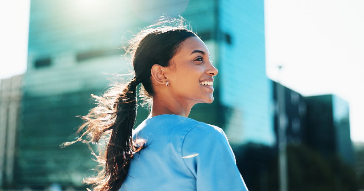 image of a nurse in scrubs outside in the city