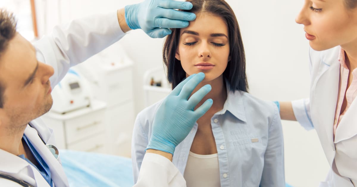 image of a woman at doctors office getting face examined