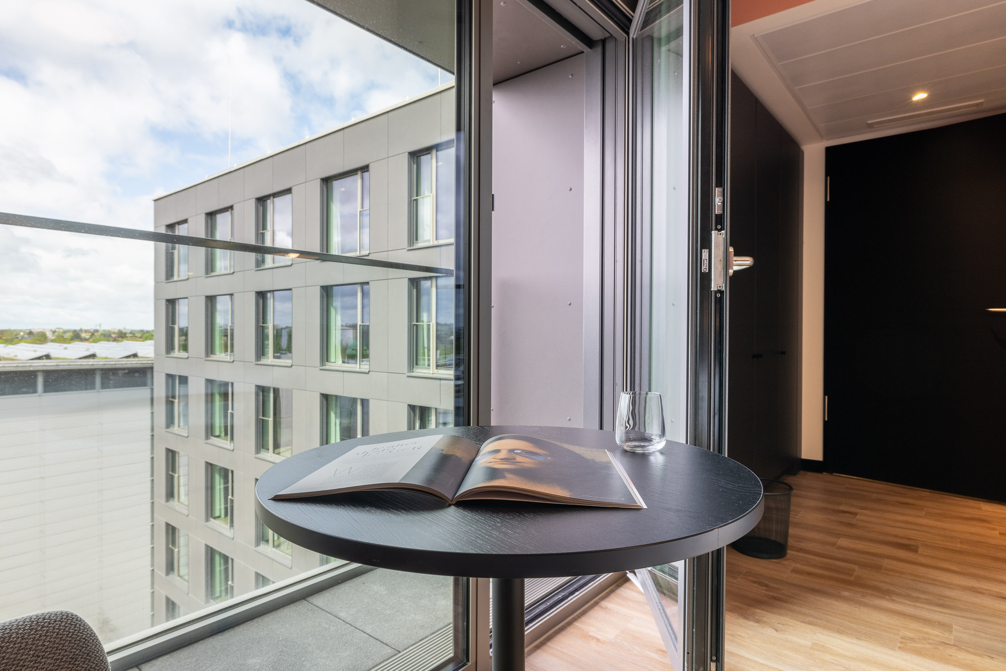Sunlit loggia of the furnished coliving apartment in Munich