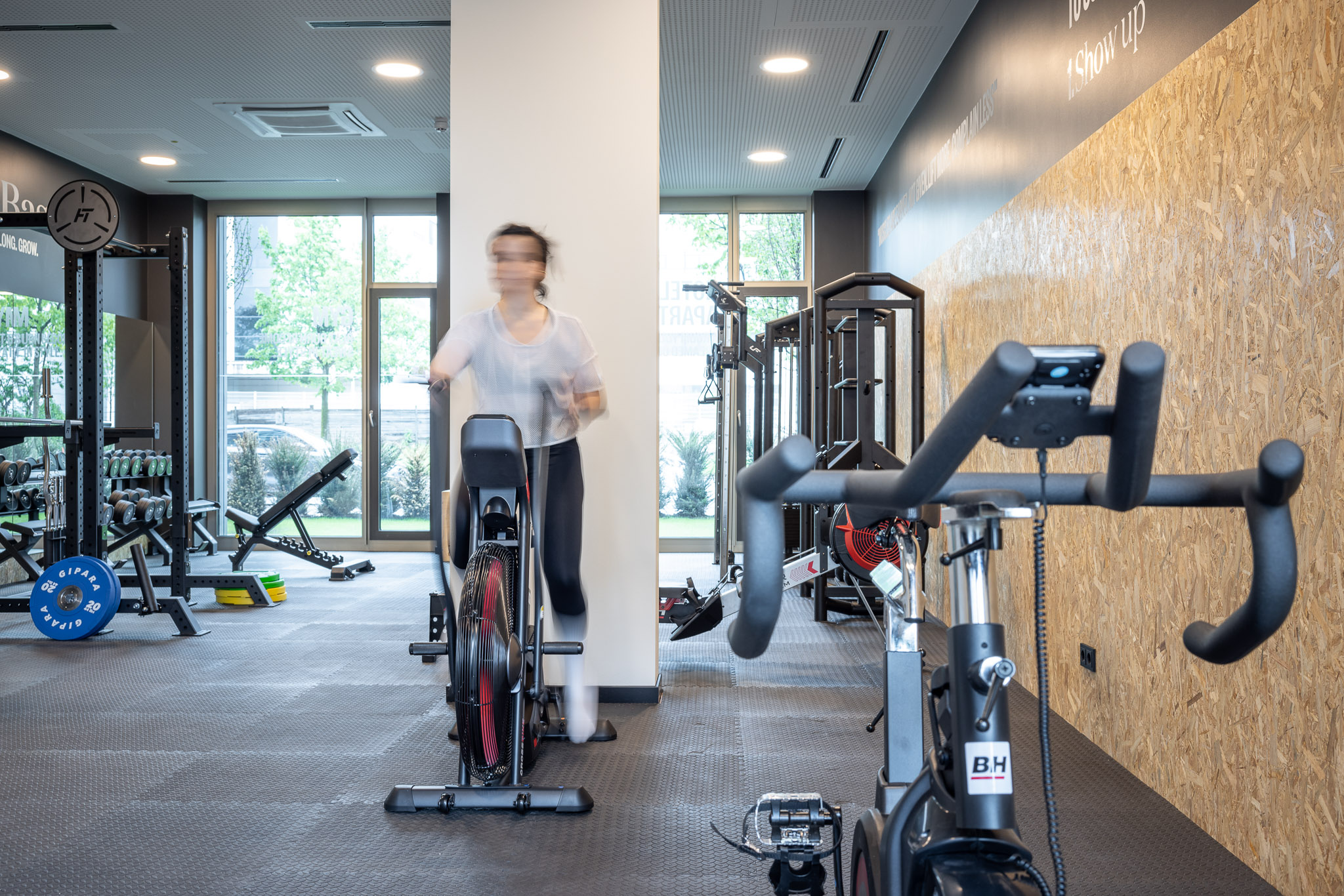 Fitness area with woman on a bike