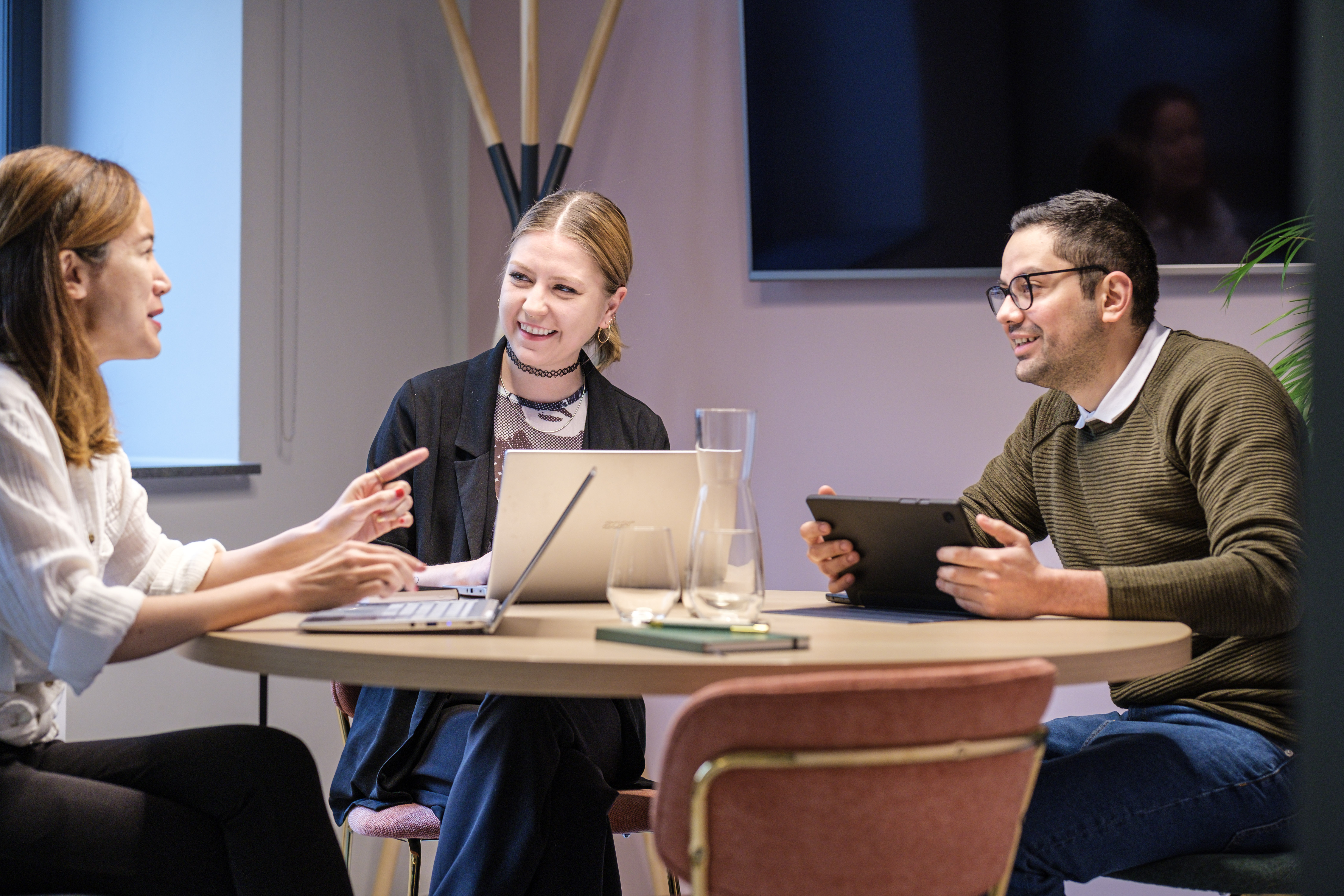 Coworking meeting with three residents at The Base