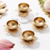 Shop Enchanting Floral Metal Diyas - Set Of 4