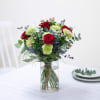 Mixed bouquet with red roses in warm and green tones Online