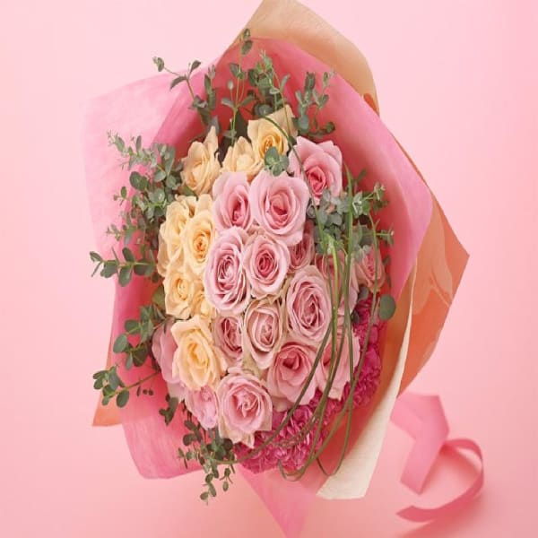 Elegant hand-tied bouquet mainly with roses