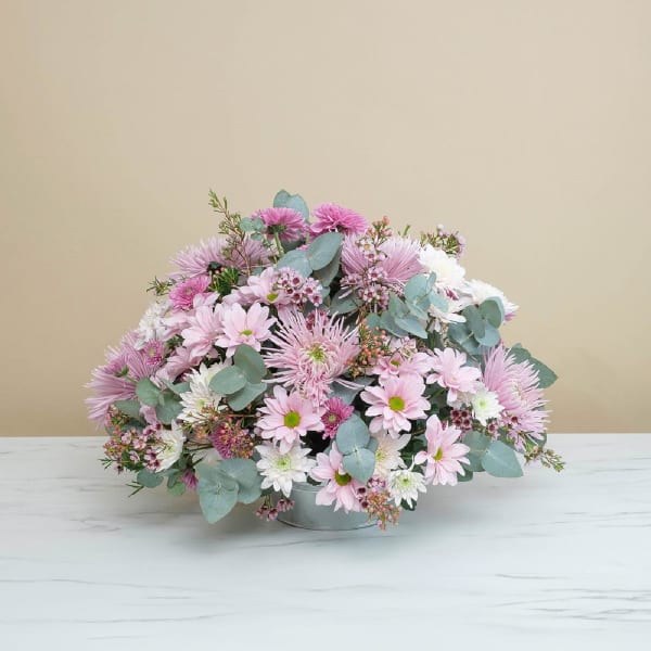 Funeral centrepiece in pink tones