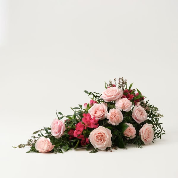 Low Funeral Arrangement in pink