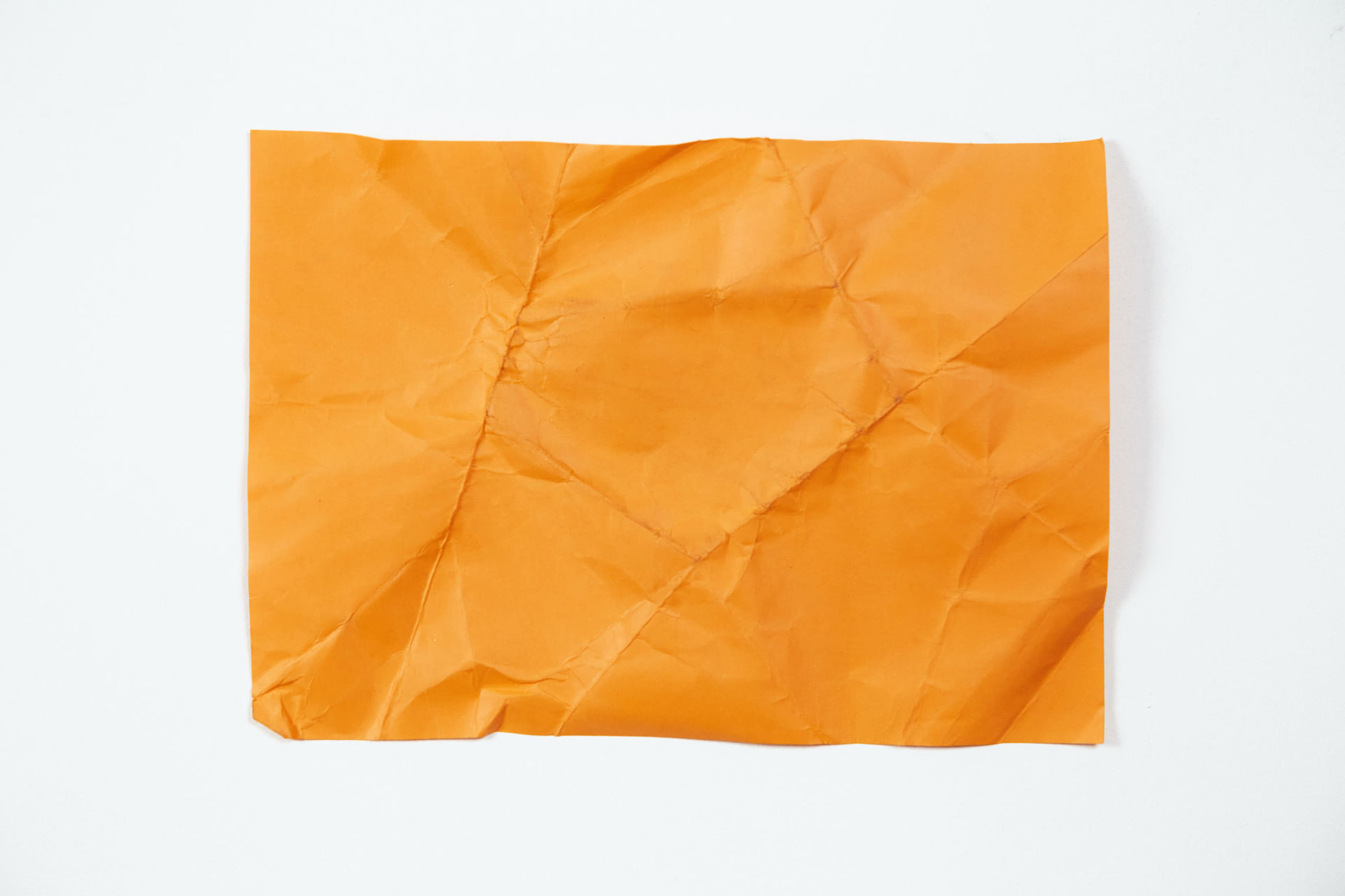 Orange crumpled sticky note