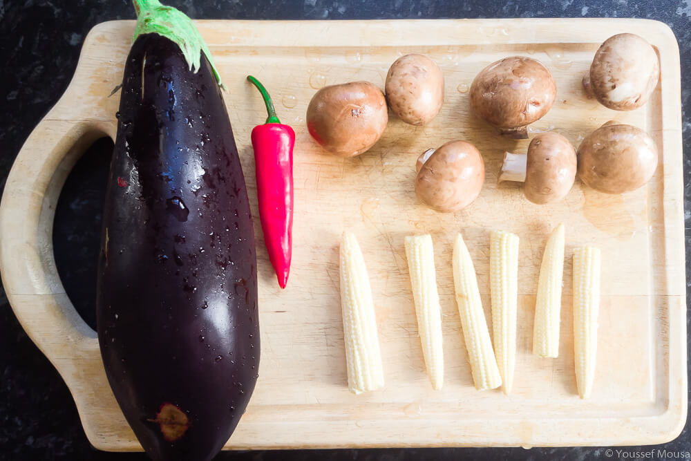 All the veg that’s going into the curry. An aubergine, chestnut mushrooms, chilli pepper and baby corn.