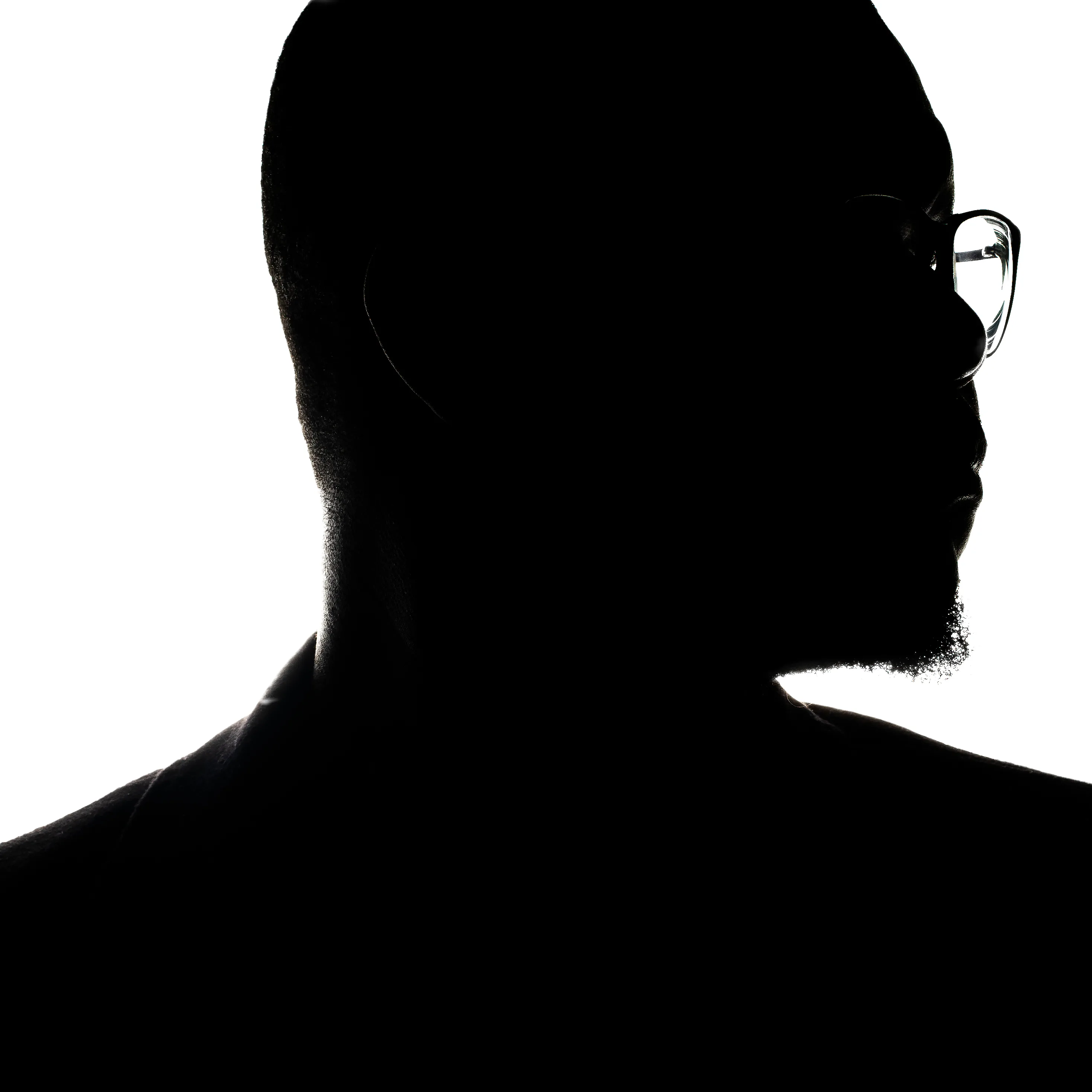 a silhouette of a man's head looking to the right