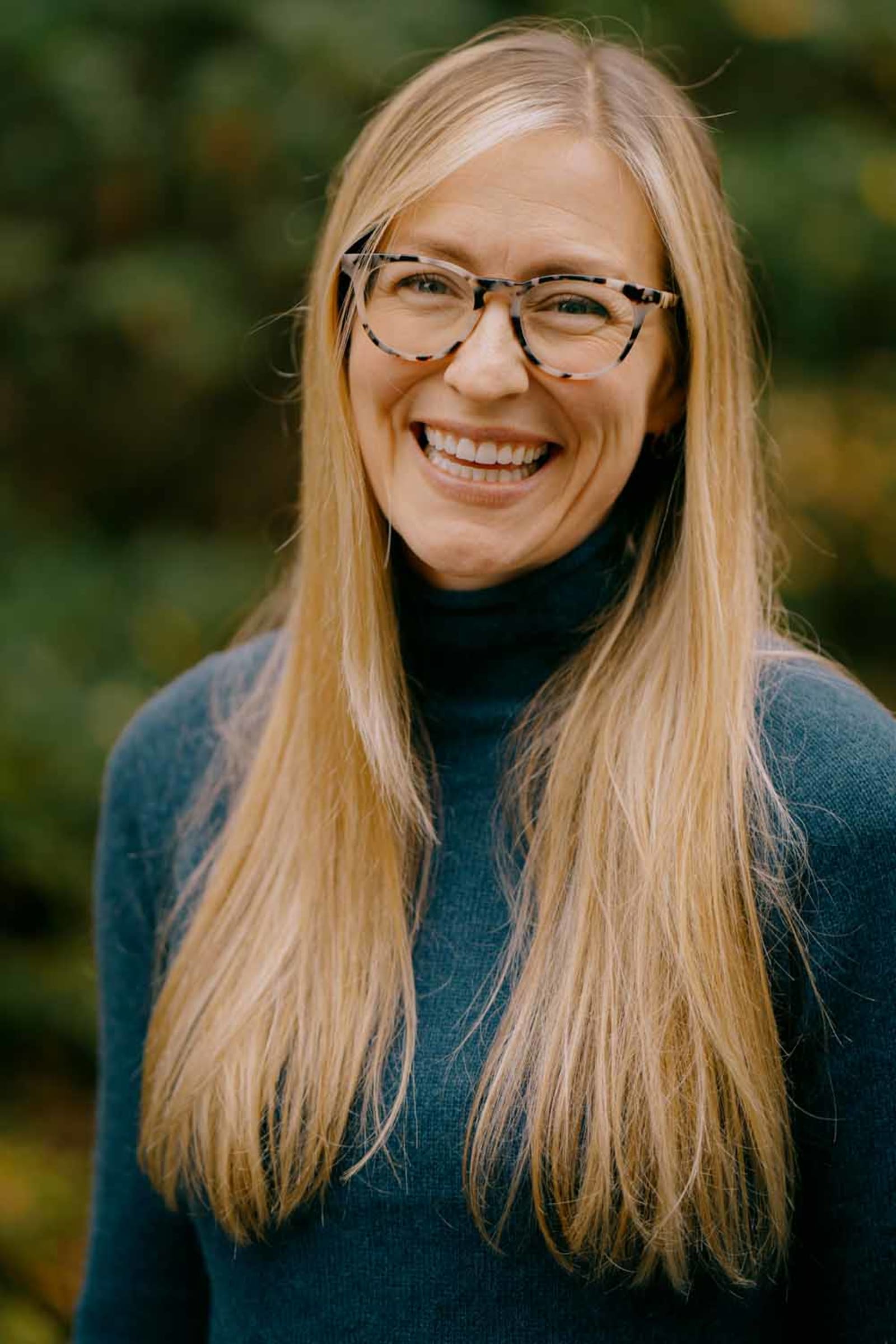 Hudson Valley professional portrait — natural-light outdoor headshot against a soft green background