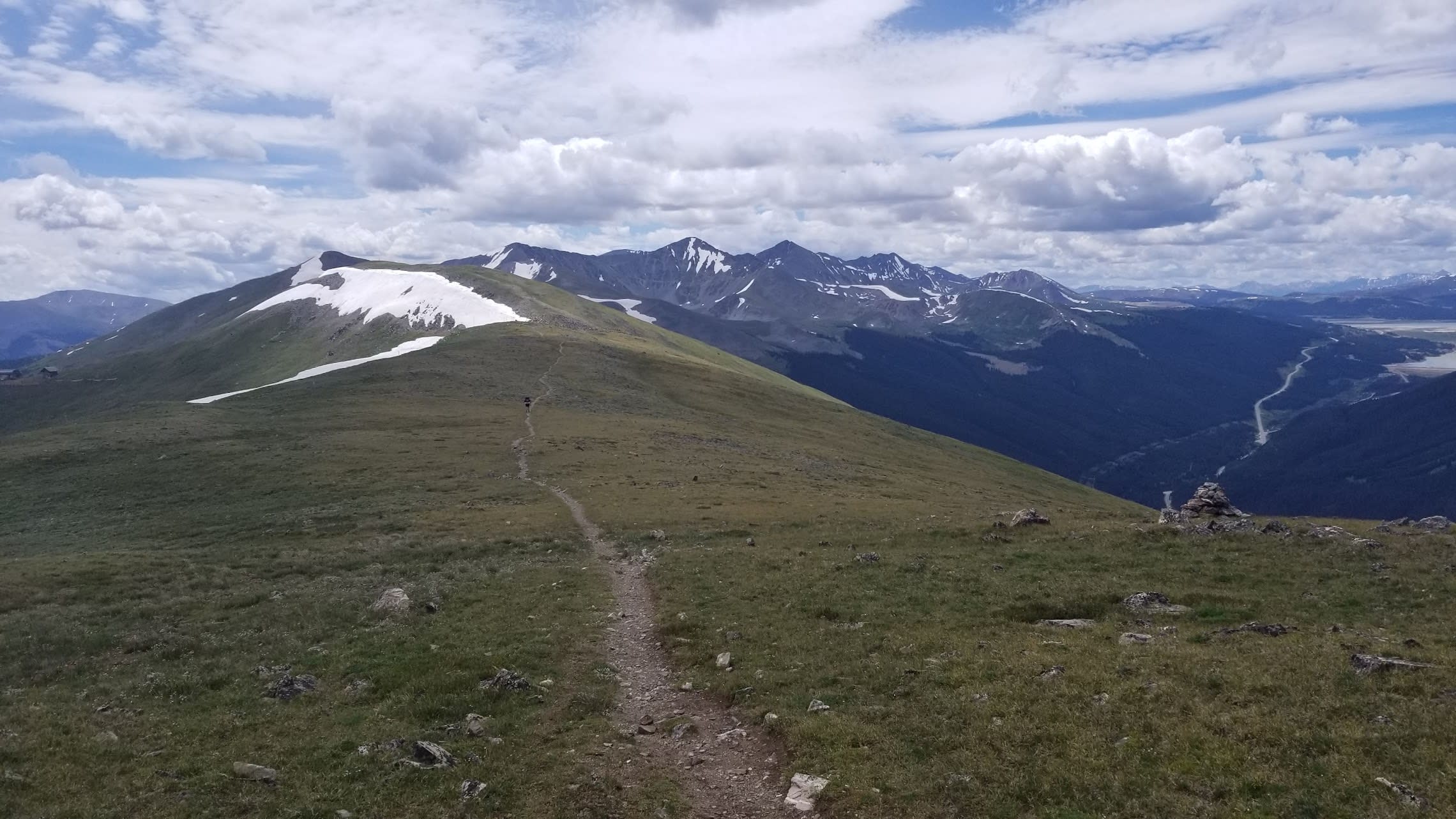 Mountains and snow from trail above treeline