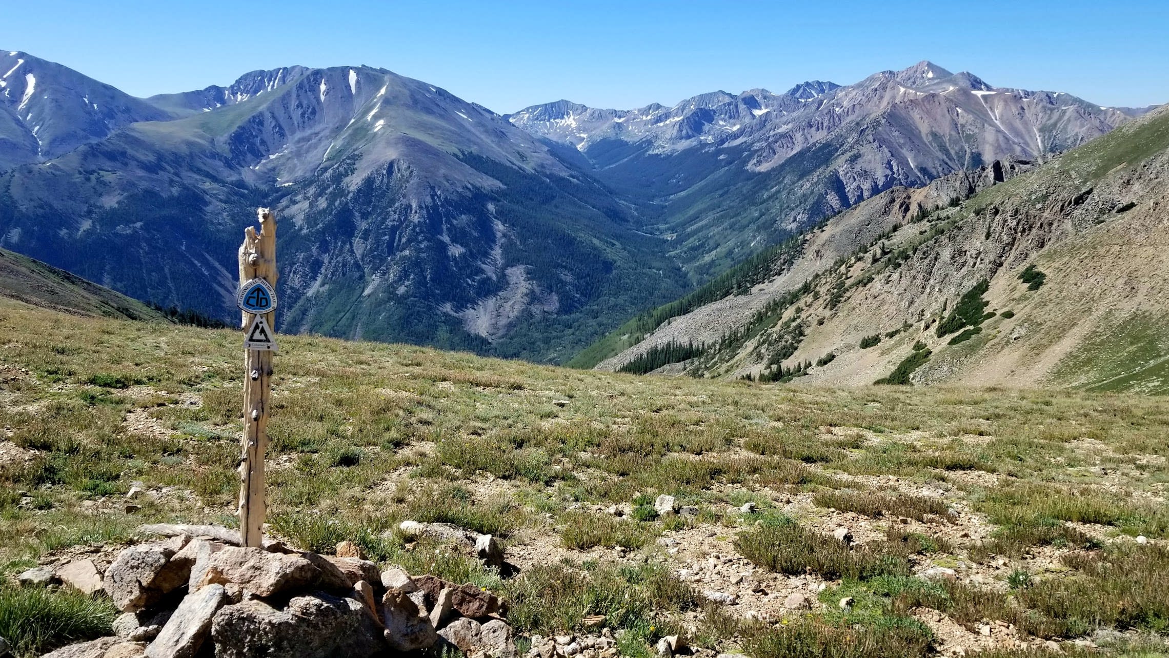 Colorado Trail sign in front of mountain view hiking out of Twin Lakes