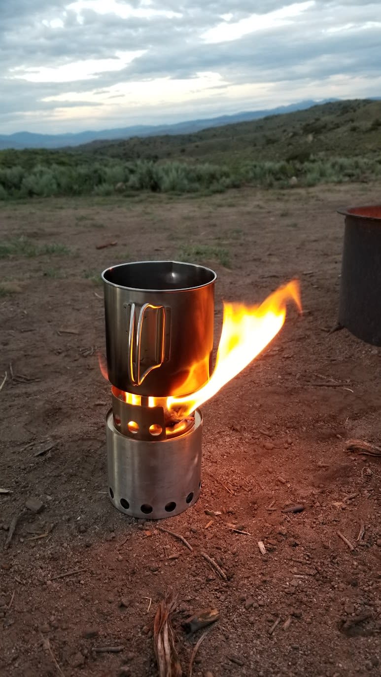 Wood-burning stove used to light a fire and boil water at camp
