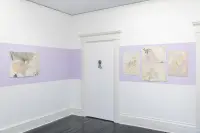 gallery installation 5 drawings and a ribbon sculpture in the corner of a room