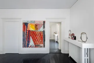 gallery installation of red oil painting and three sculptures