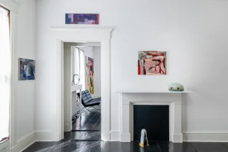 gallery installation of oil paintings and two sculpture