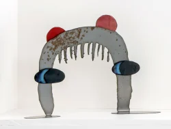 steel sculpture that looks like a face