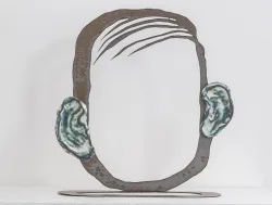 steel sculpture that looks like a face