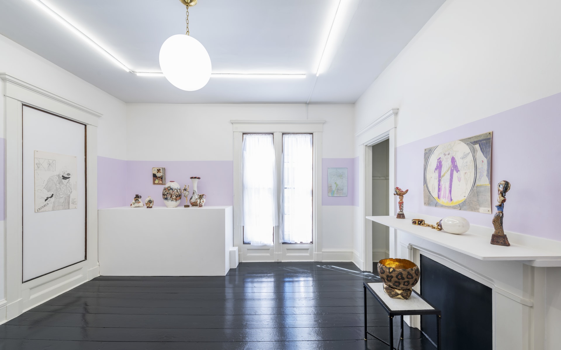 gallery installation of drawings and sculptures