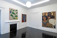 gallery installation of three oil paintings on a wall