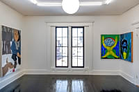 gallery installation of three oil paintings on a wall