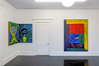 gallery installation of three oil paintings on a wall