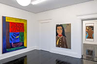 gallery installation of oil paintings on a wall