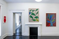 gallery installation of three oil paintings on a wall