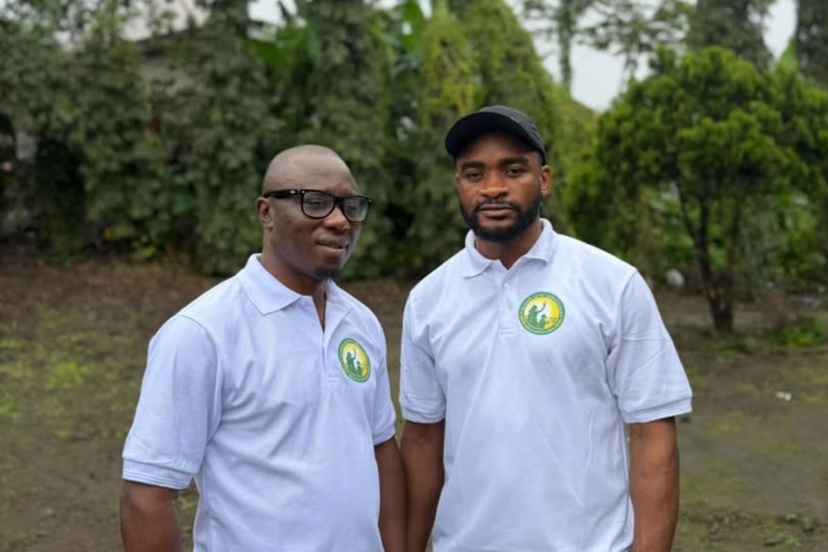 Two members of the Foundation team in its logo polo shirts