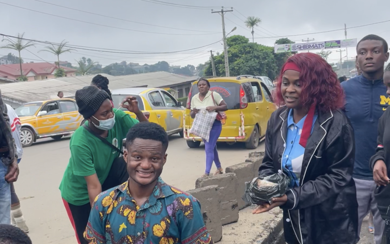 Volunteers gather along a roadside during the community clean-up