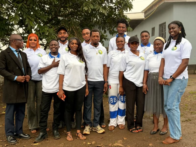 Members of the Foundation team and volunteers, most in its logo polo shirts, pose for a group photo