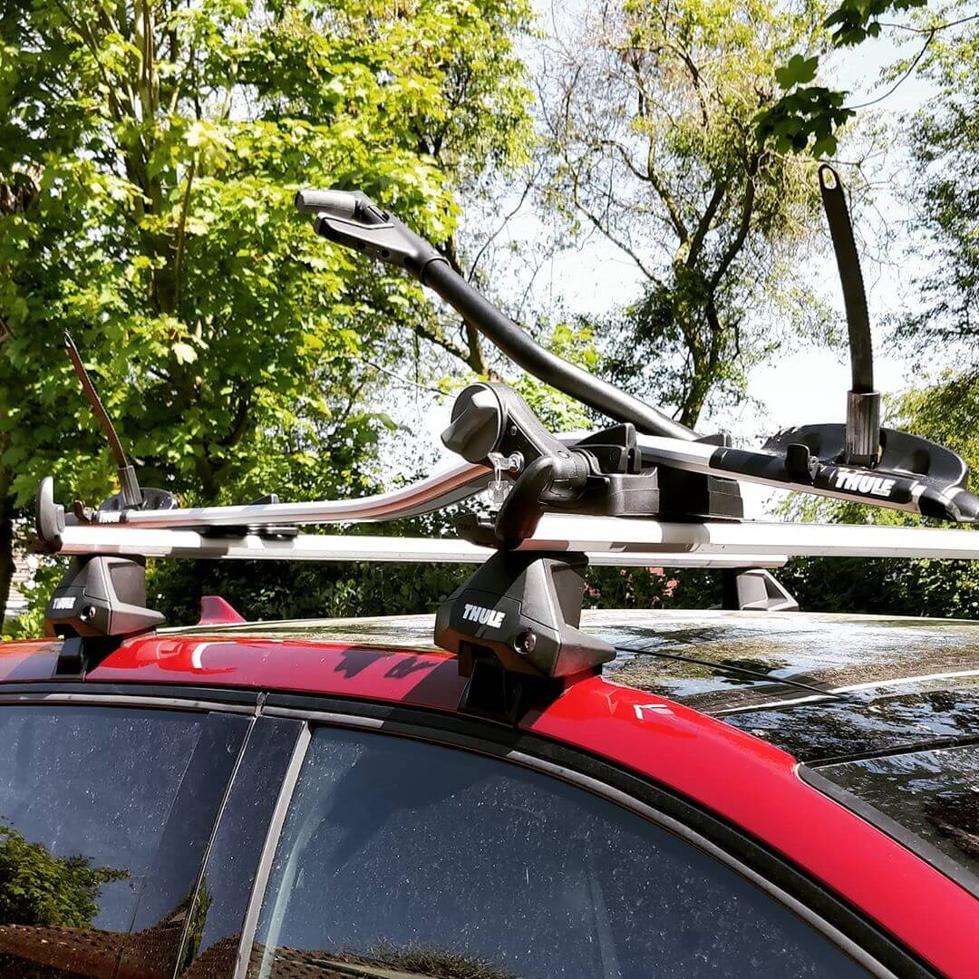 Roof bars and bike carrier on the roof of a car