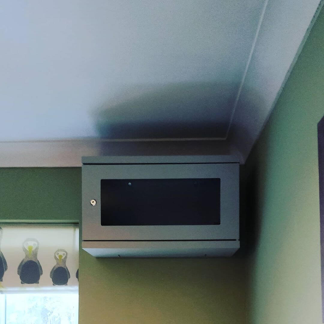 Network cabinet attached to wall