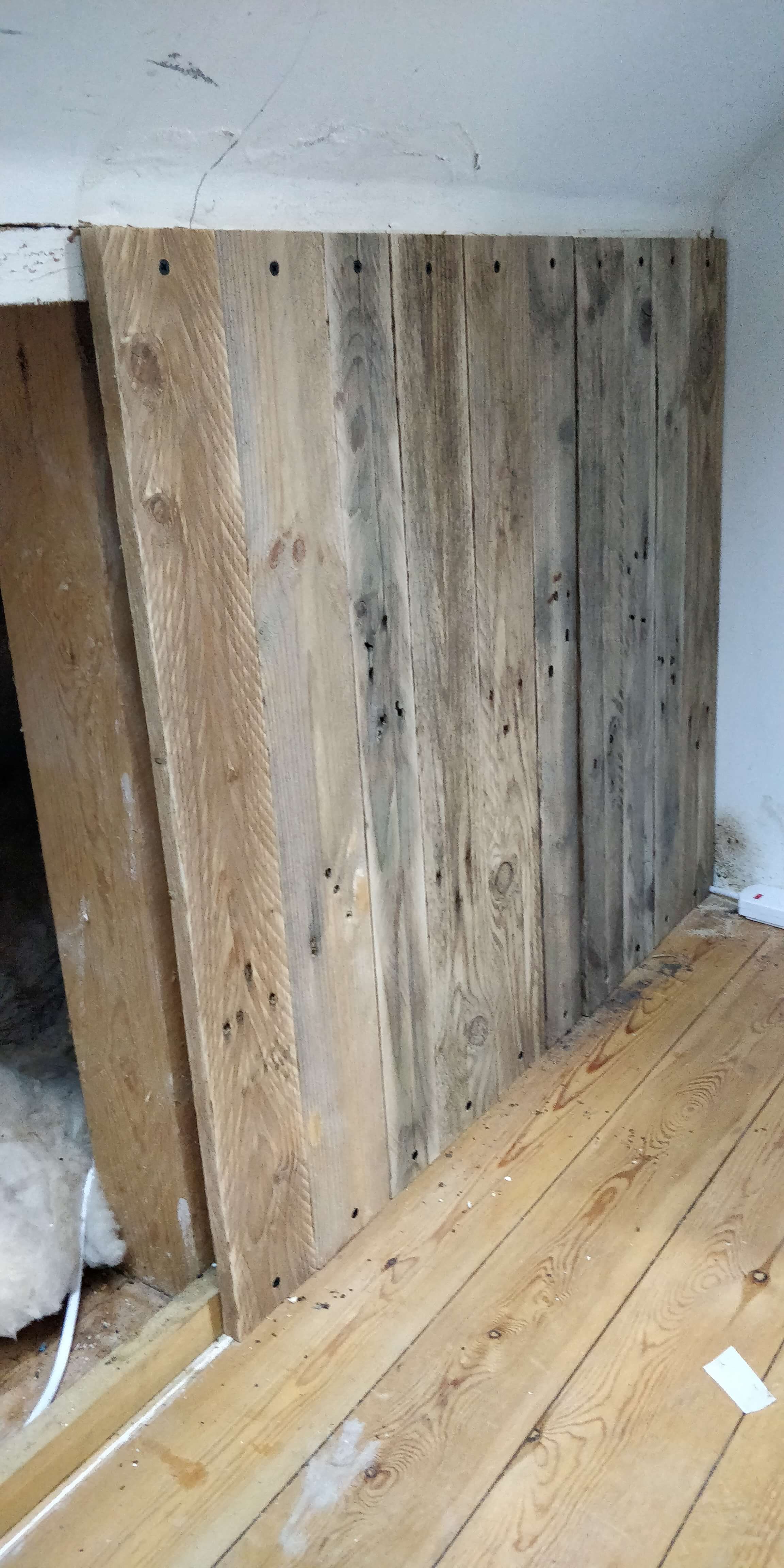 Pallet wood planks covering loft gap