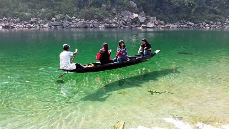 Boating in the crystal clear waters of Dawki