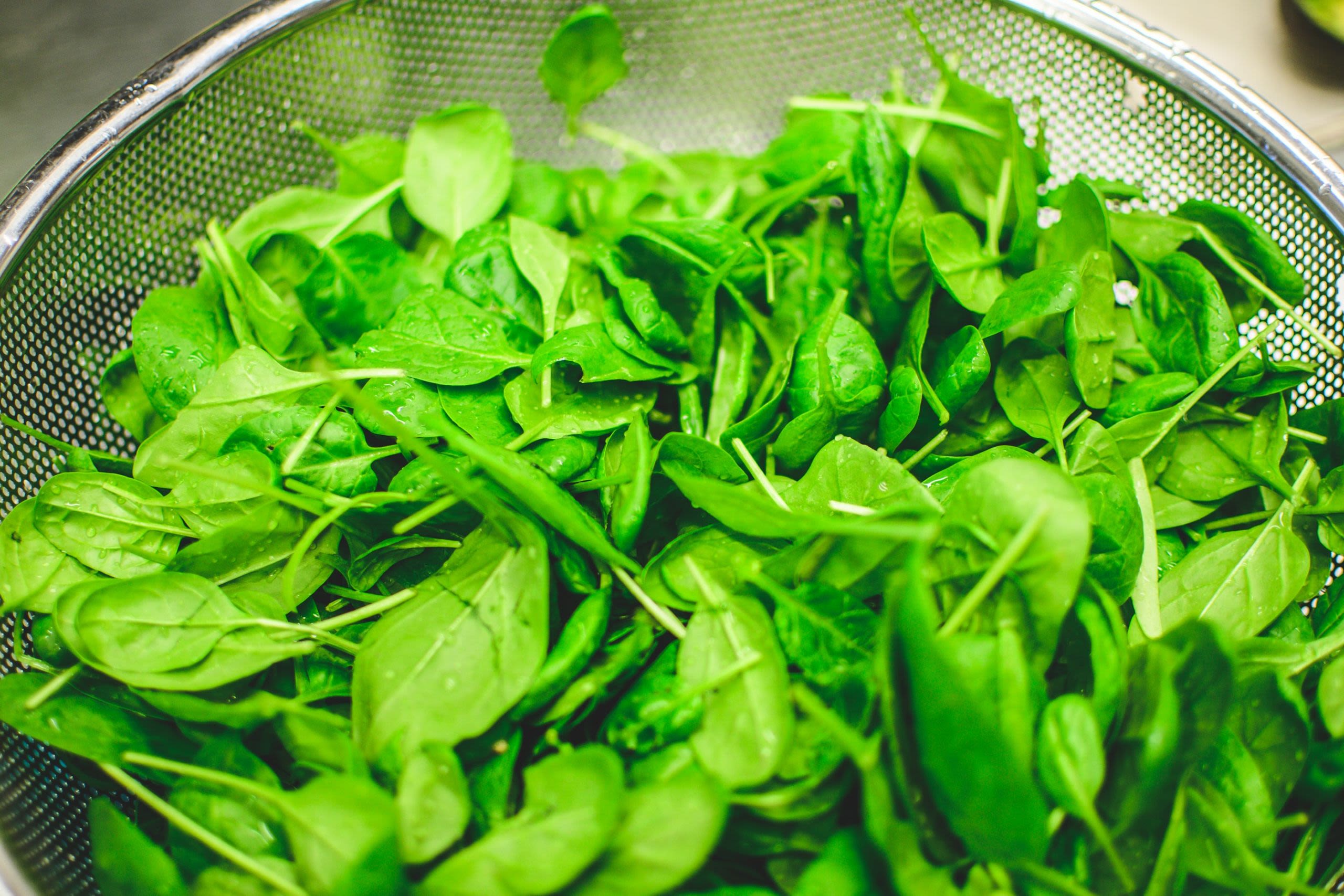 Spinach leaves in a colander