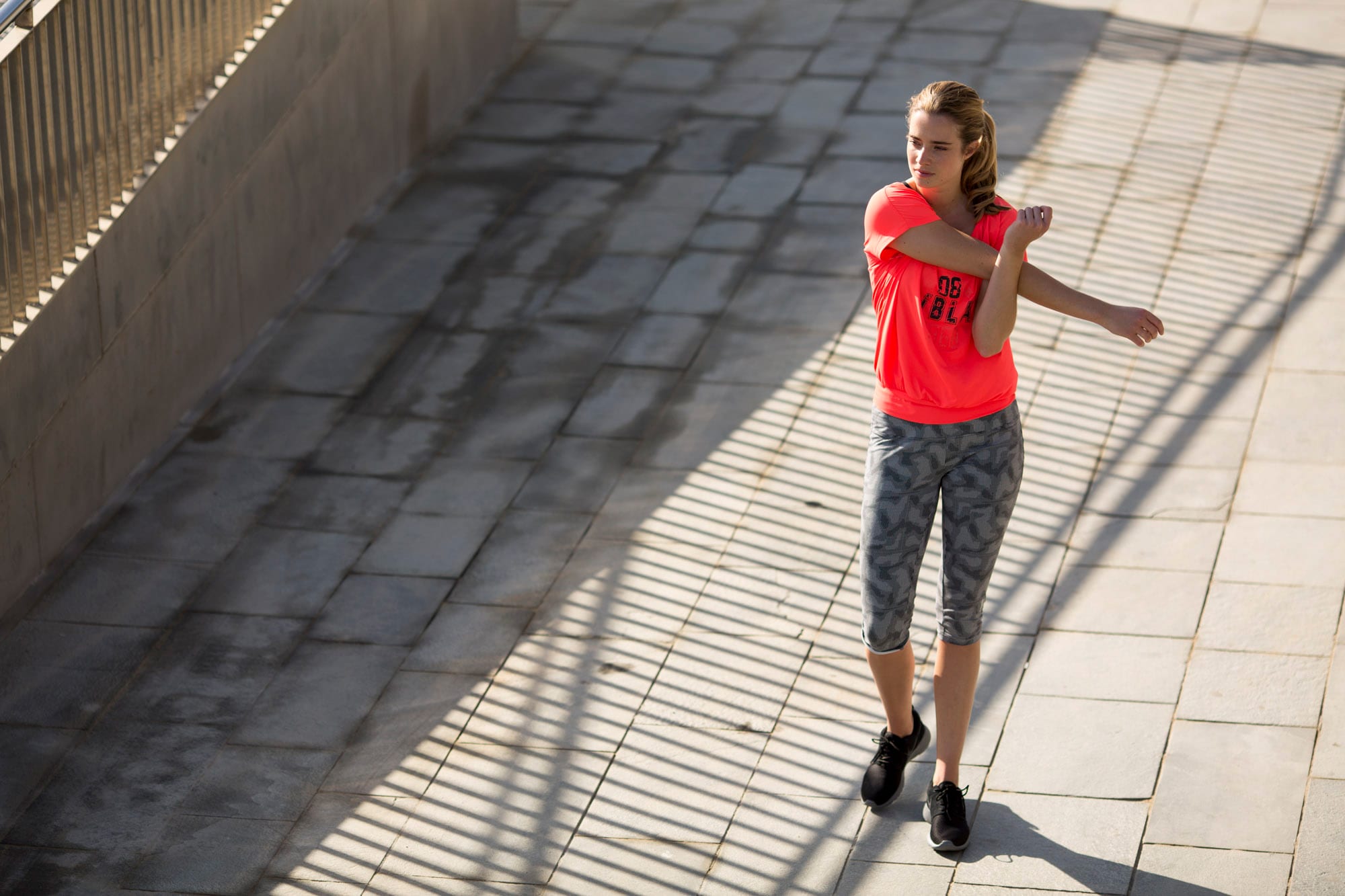 Woman stretching while running.